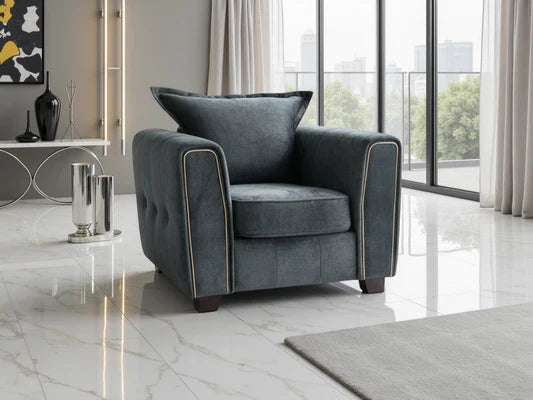 Serena Elegant Fabric Armchair with Metal Trim and Quilted Sides