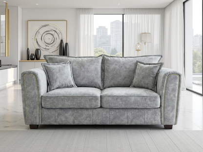Serena Grey Two-Seater Sofa: Modern Quilted Design, Chic Metal Trim Accents