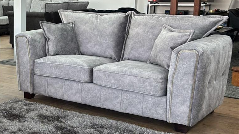 Serena Grey Two-Seater Sofa: Modern Quilted Design, Chic Metal Trim Accents