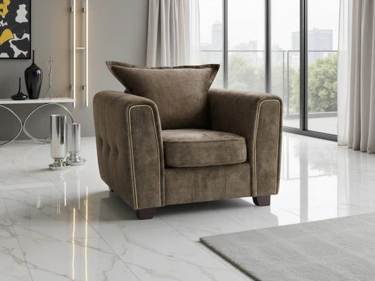 Serena Elegant Fabric Armchair with Metal Trim and Quilted Sides