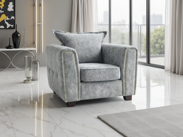 Serena Elegant Grey Fabric Armchair with Metal Trim and Quilted Sides
